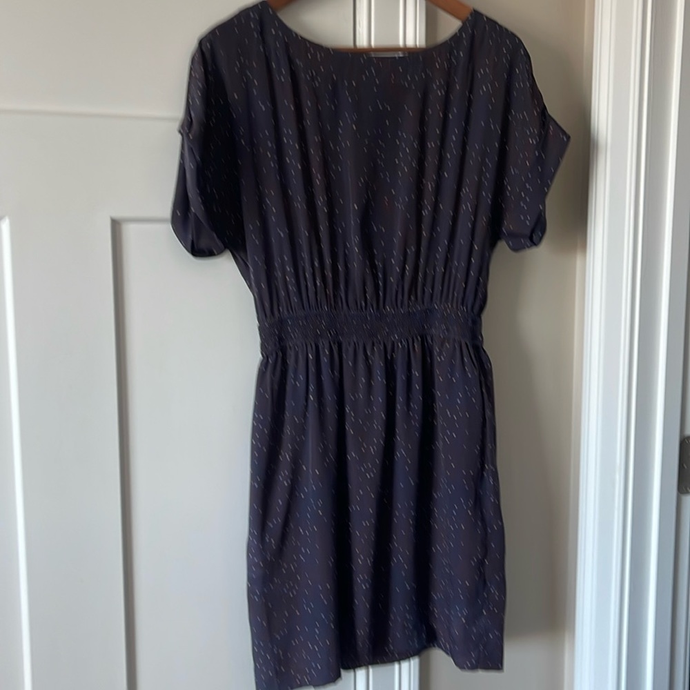 Light dress with pockets. The back has a small peekaboo.